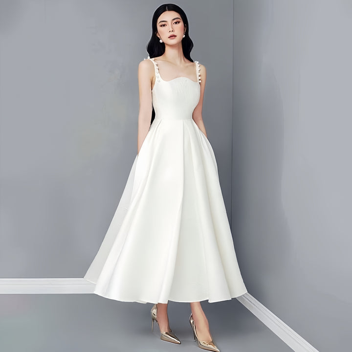 White dress with pearl-embellished straps