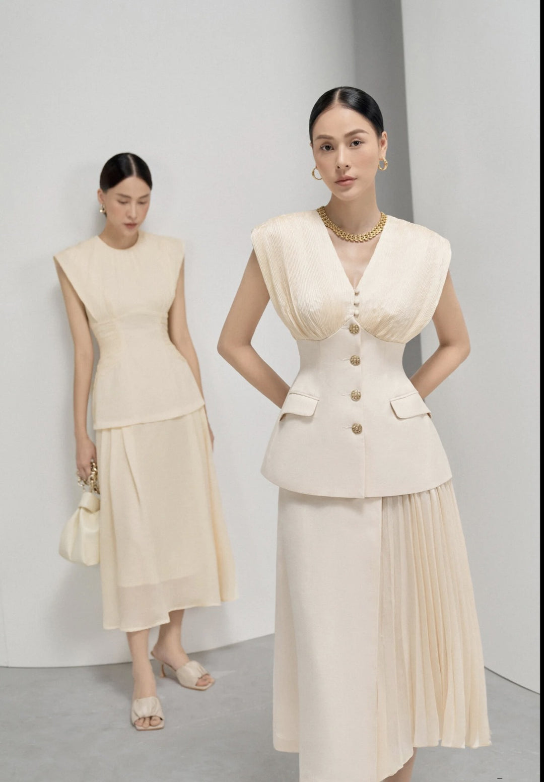 Elegant Beige Sleeveless Dress with Pleated Design and Gold Buttons