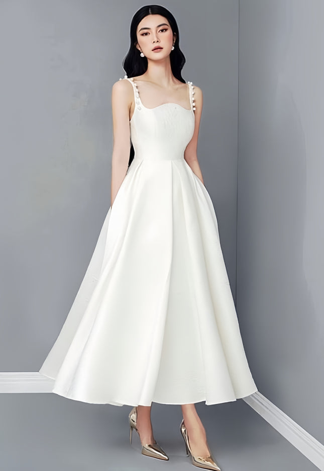 White dress with pearl-embellished straps